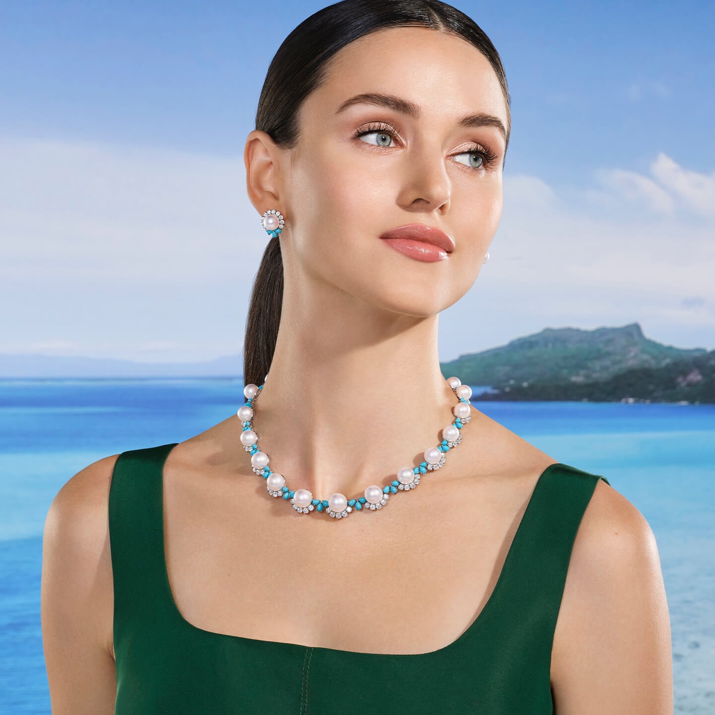 A model wearing a pair of Bora Bora Earrings by Harry Winston. 