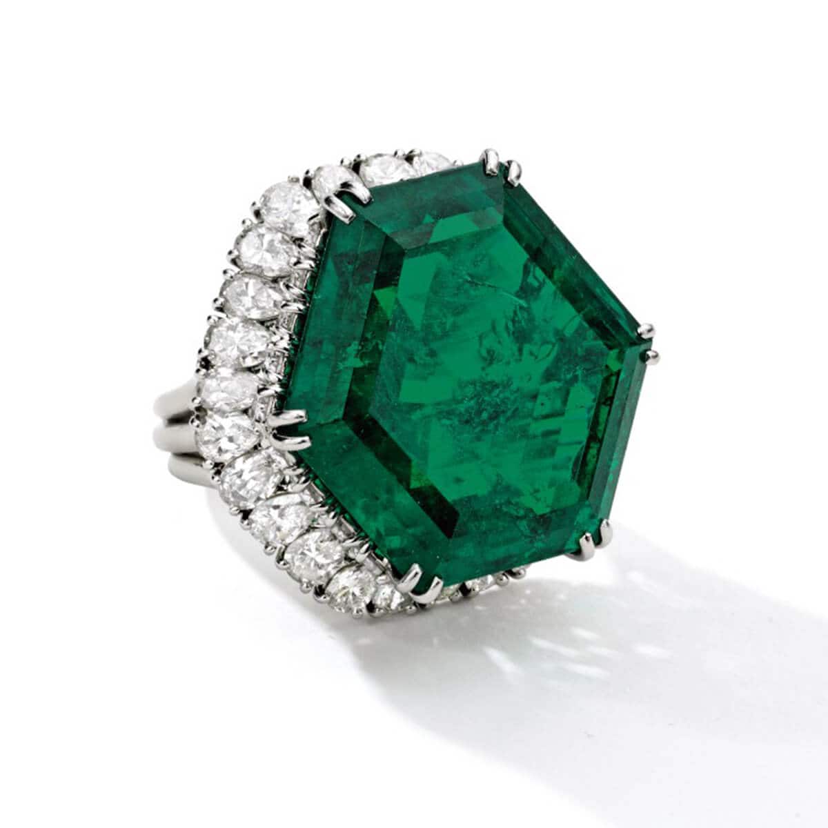 Image of The Stotesbury ring featuring a hexagonal-shaped Colombian emerald center stone weighing a total of 34.40 carats
